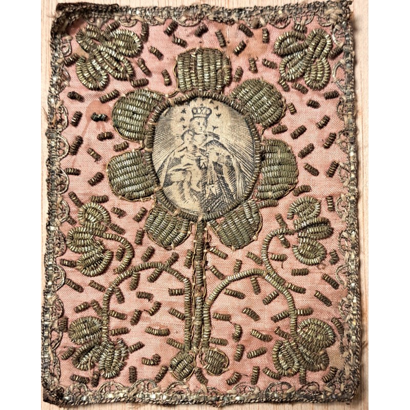 Relicary or plaque, 19th century Virgin Mary with child embroidered in gold thread