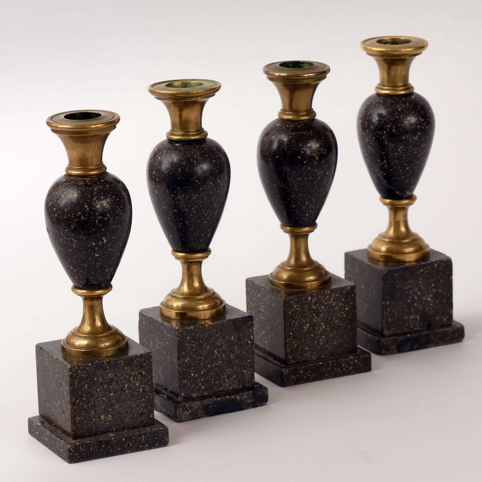 Four brass and porphyry candlesticks from Sweden, 1820-40